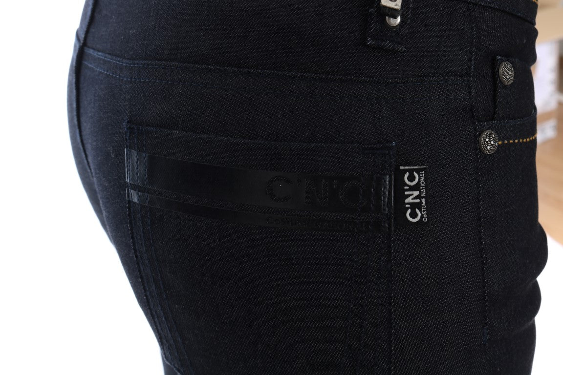 Dark denim jeans with visible stitching and brand label on back pocket