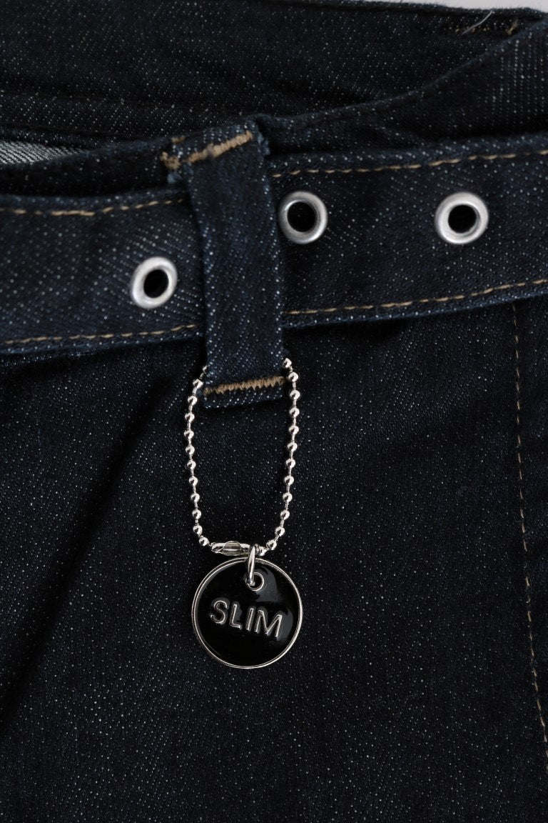 Silver necklace on blue jeans