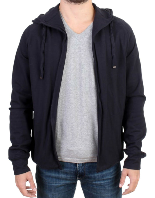 Man wearing a dark jacket over a gray shirt