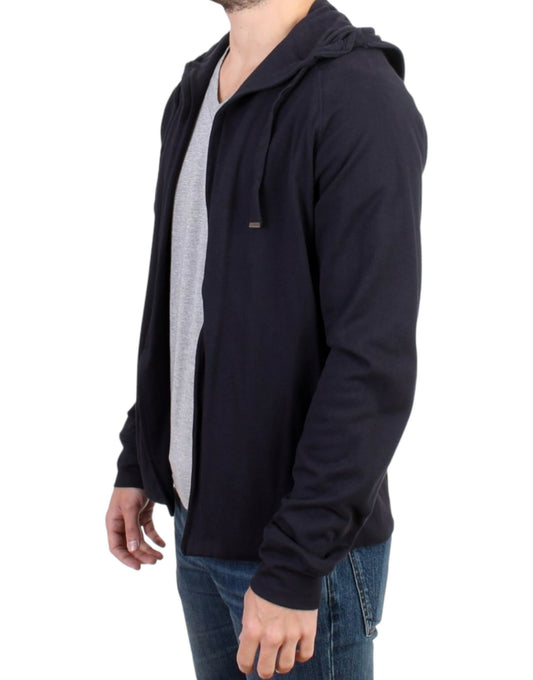 Man wearing black jacket over gray shirt