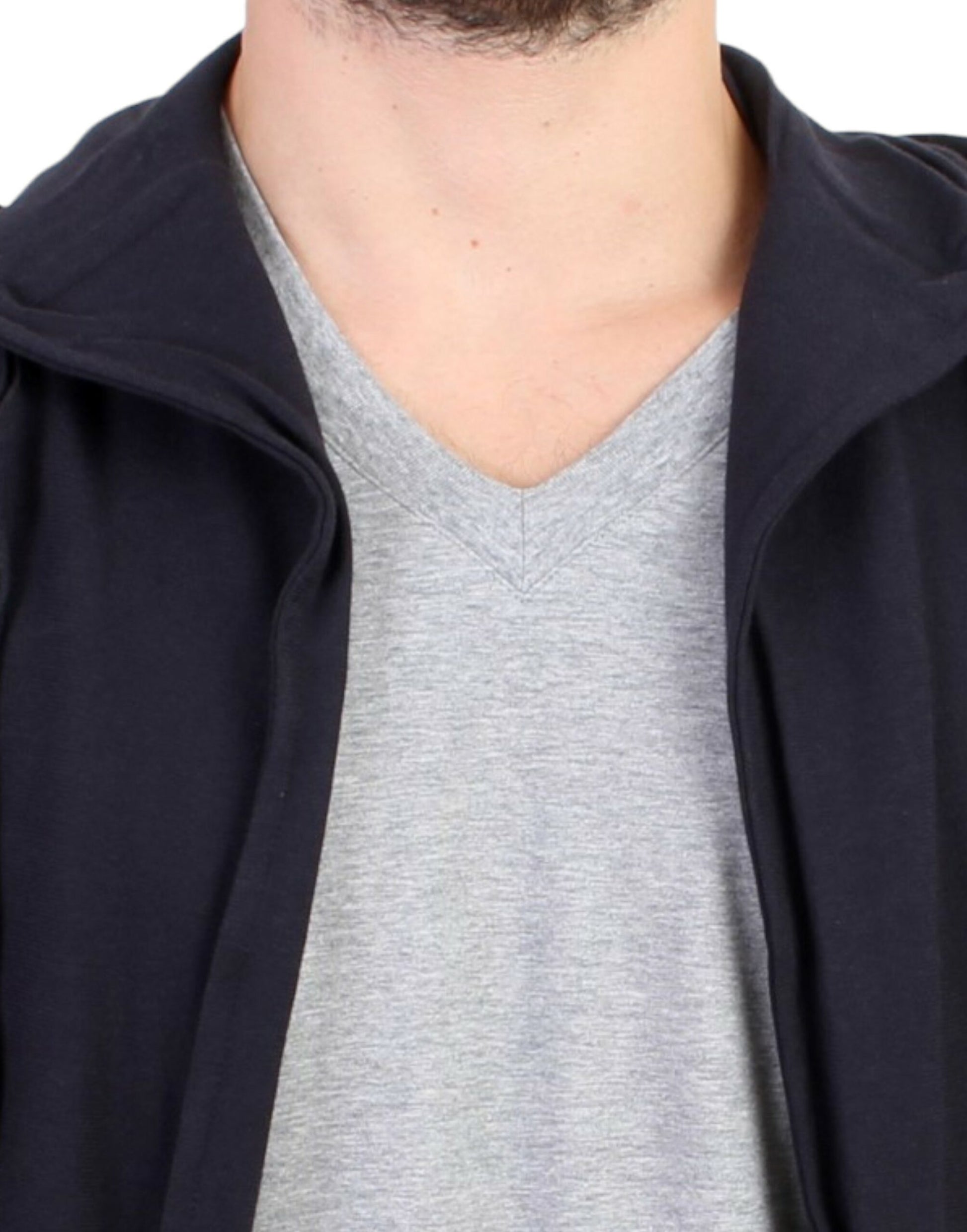 Man wearing a gray sweater vest over a gray turtleneck