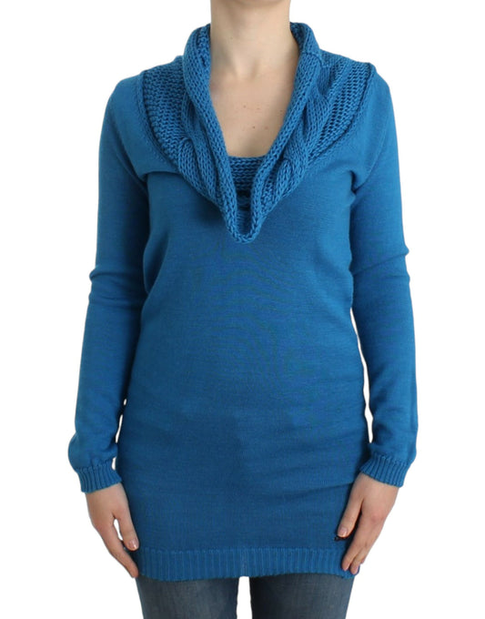 Blue crocheted sweater on woman's torso