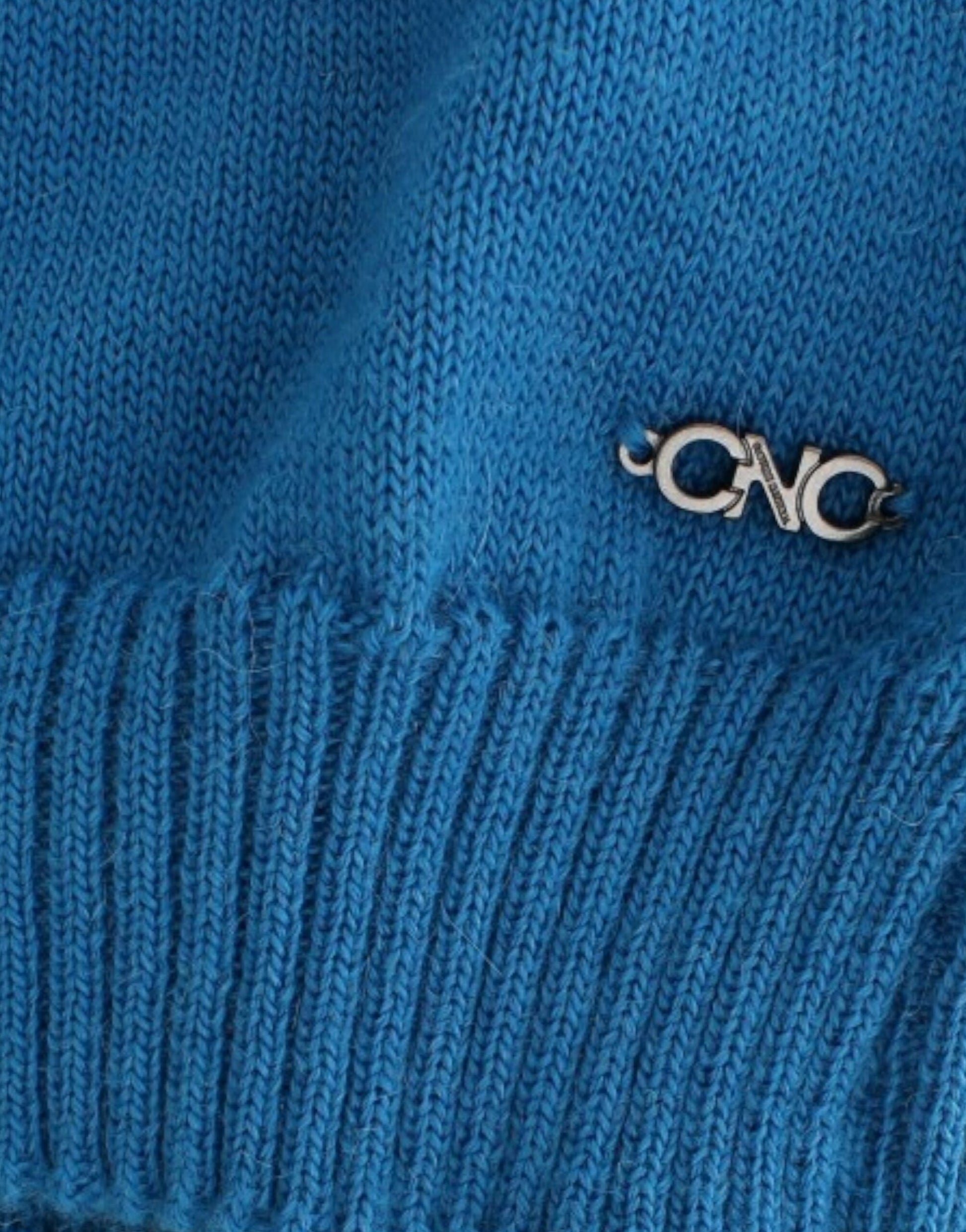Blue knit sweater with logo on cuff