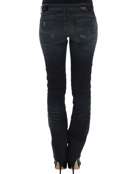 Pair of women's jeans with distressed design and rips on thighs