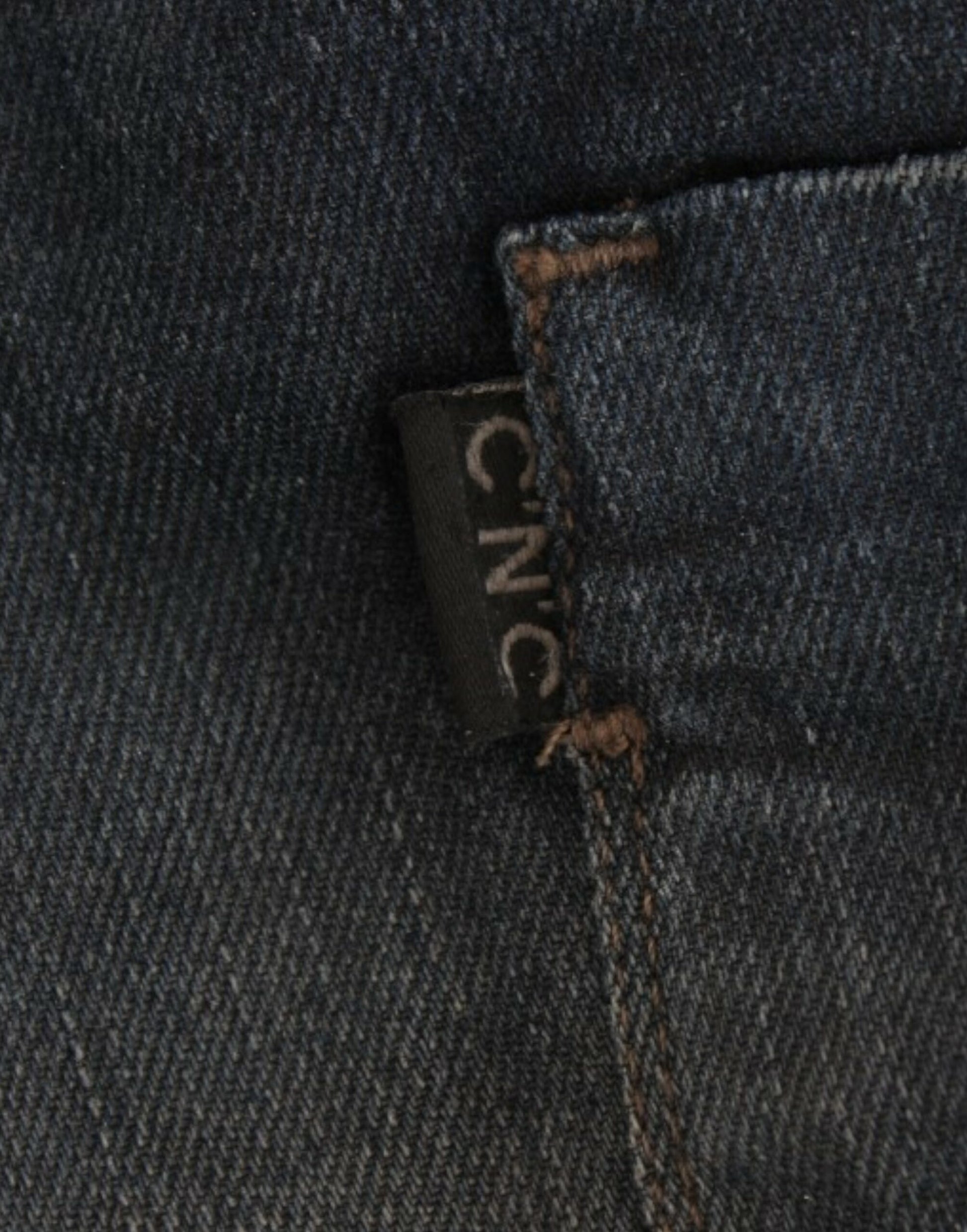Pair of blue jeans with a label on the waistband