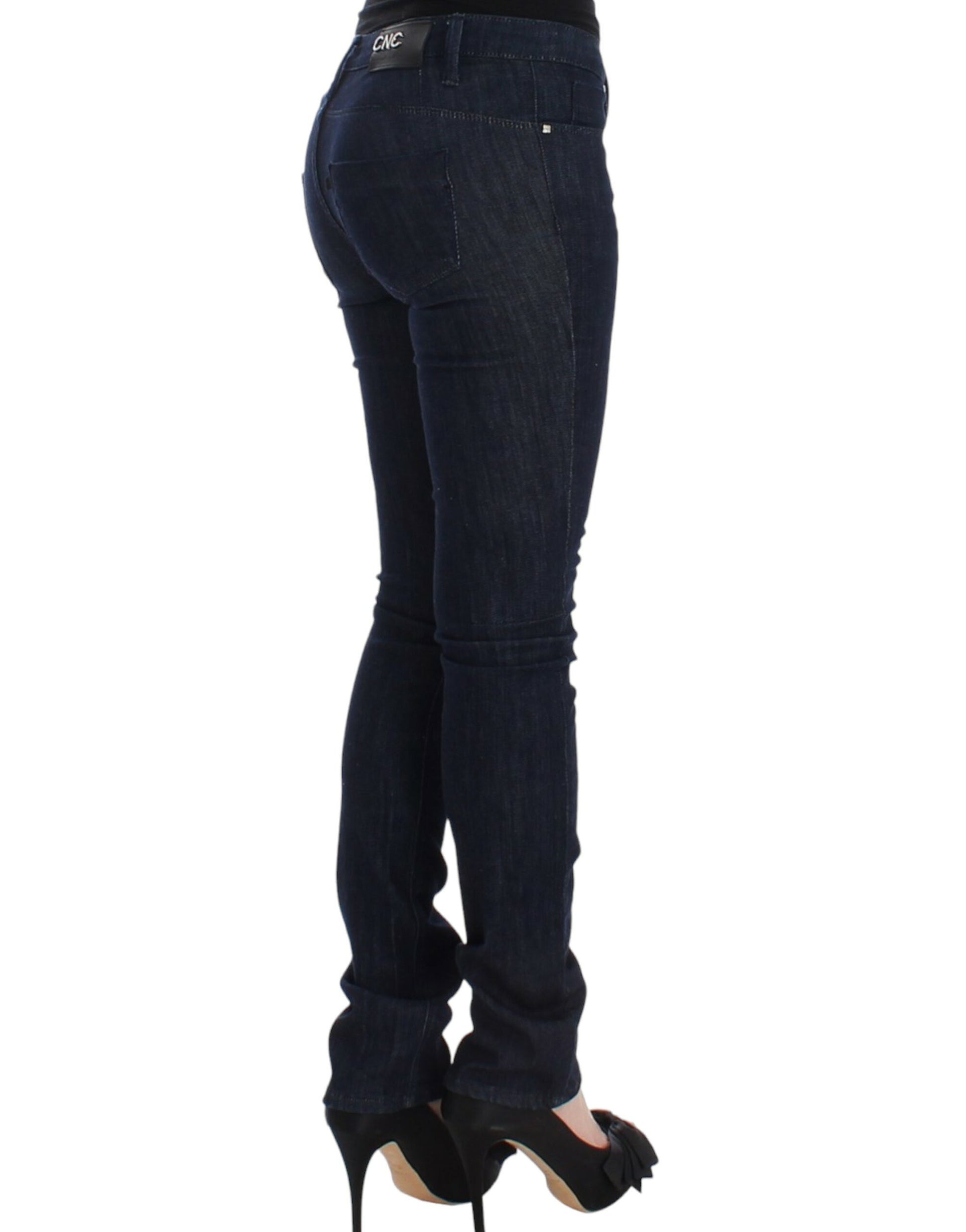 Woman wearing blue jeans and black high heels