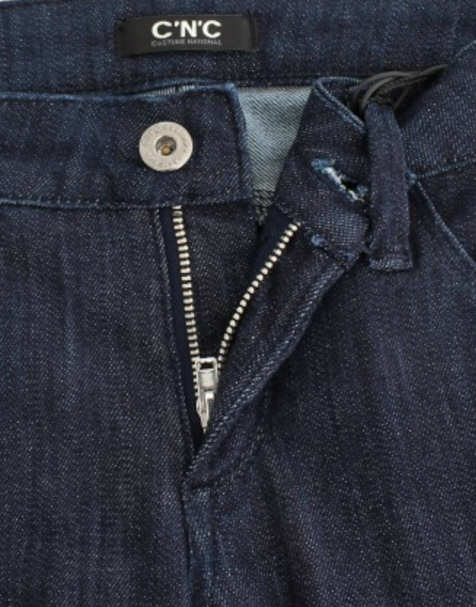Blue denim jeans with zipper and button closure