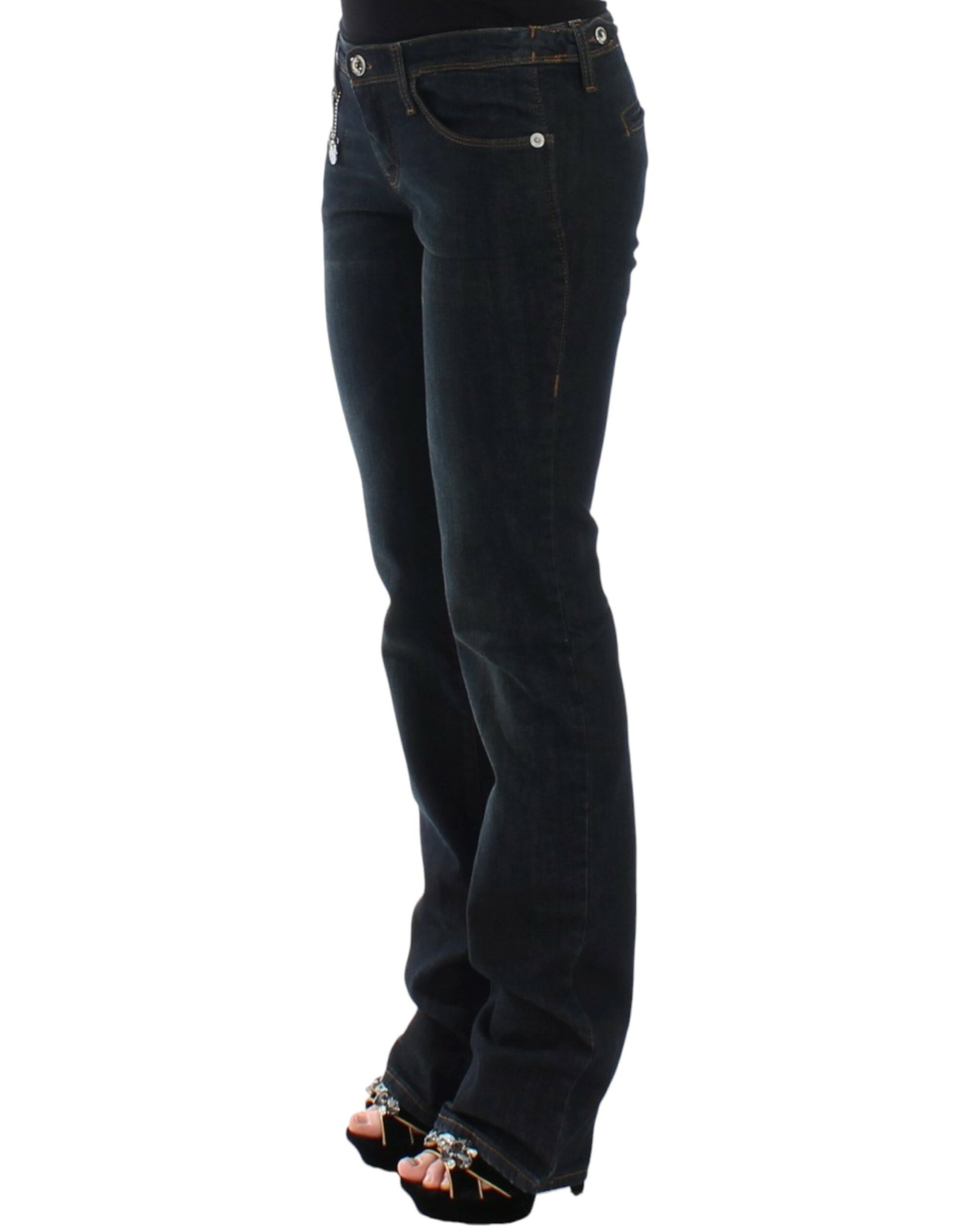 Woman wearing blue jeans and black high heels