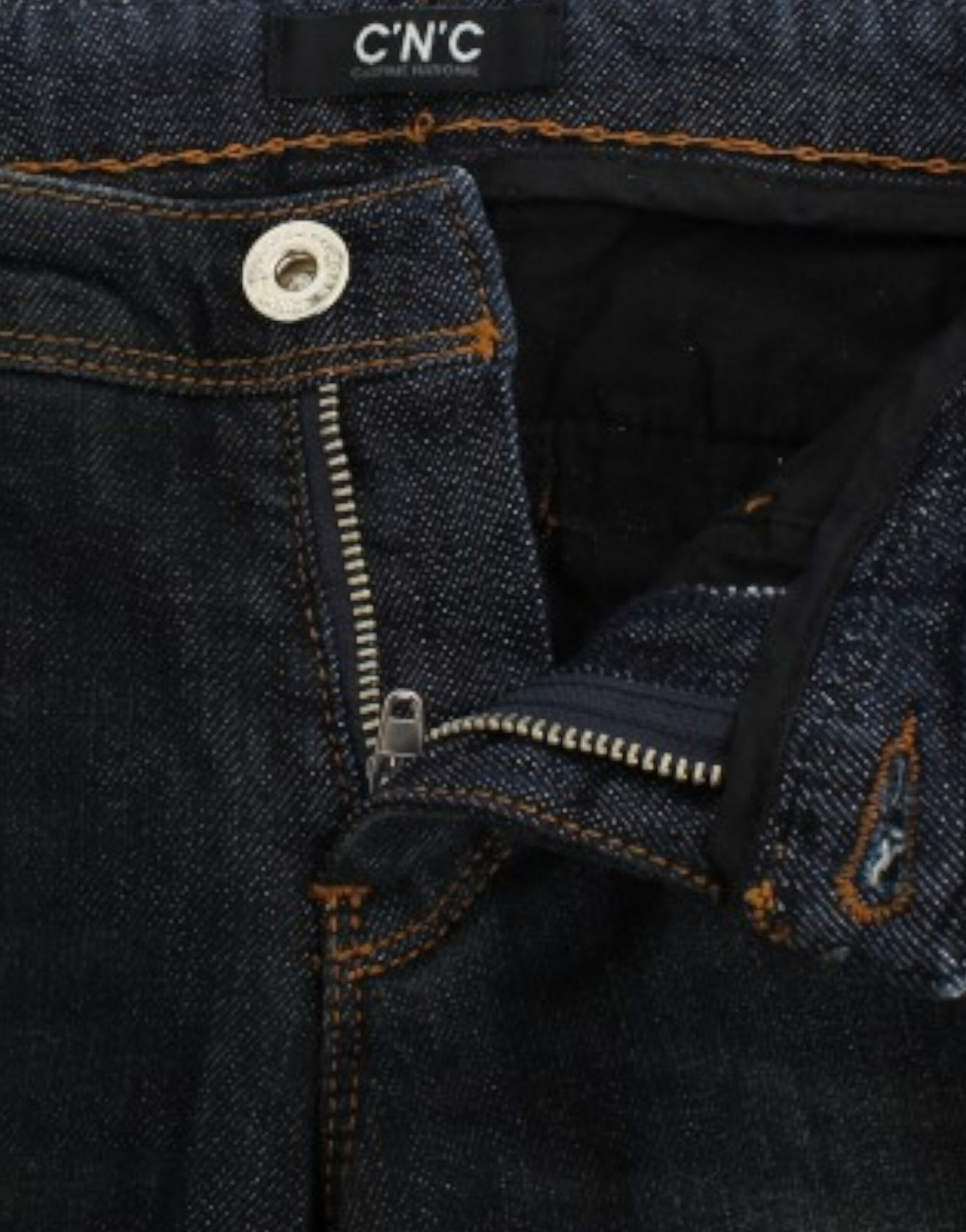 Blue denim jeans with zipper and button closure