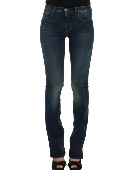 Pair of women's jeans with faded wash and distressed areas on thighs