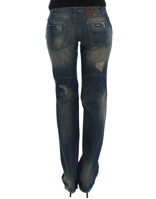 Pair of blue jeans with distressed areas and faded spots