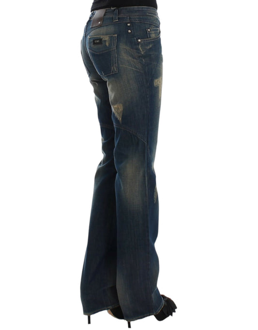 Pair of blue jeans with faded areas and bell bottom style