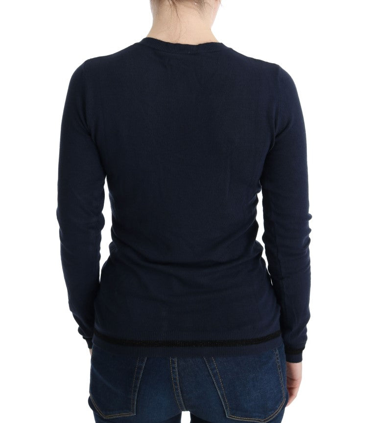 Navy blue long sleeve sweater on woman's back