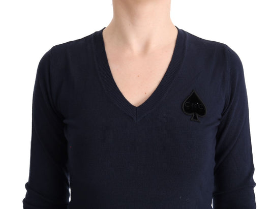 A dark blue sweater with a small black patch on the left chest area