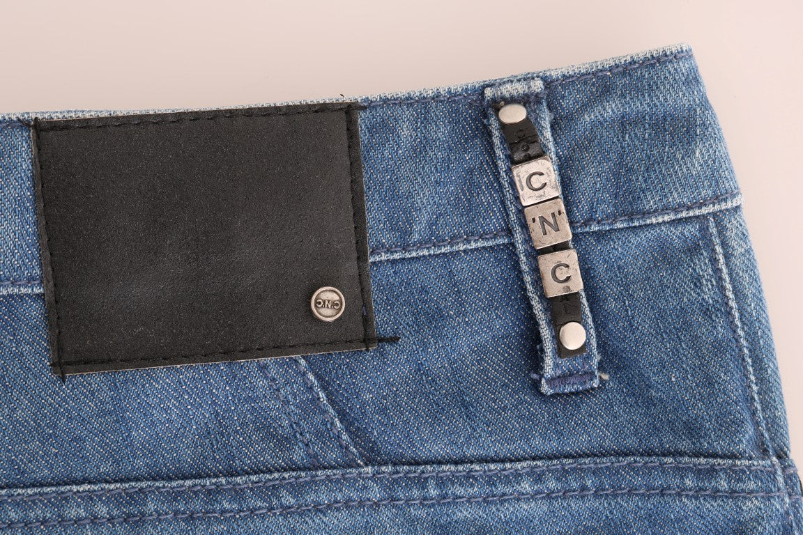Pair of blue jeans with black leather patches on back pockets