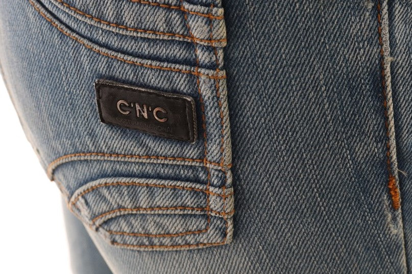 Pair of blue jeans with a CNC label on the back pocket