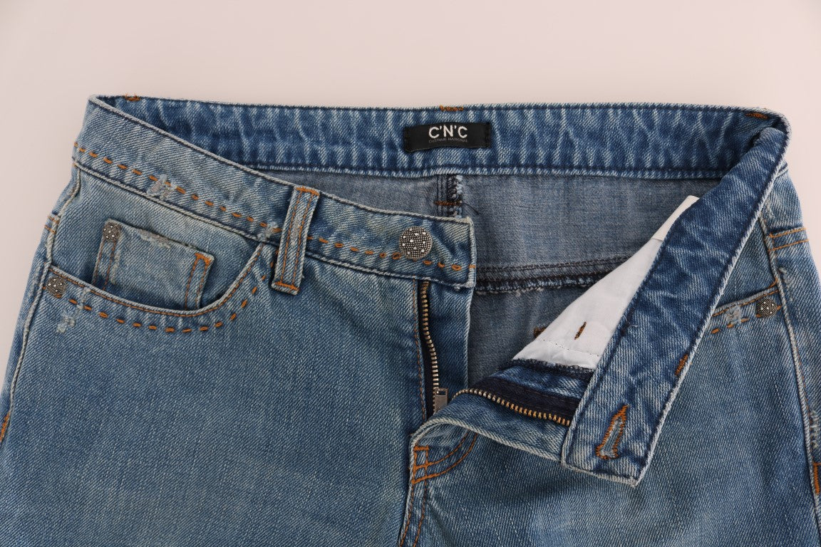 Pair of blue denim jeans with visible stitching and a tag on the waistband