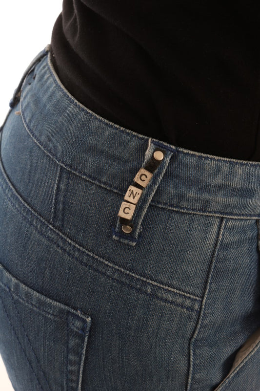Blue denim jeans with a small metal tag on the waistband