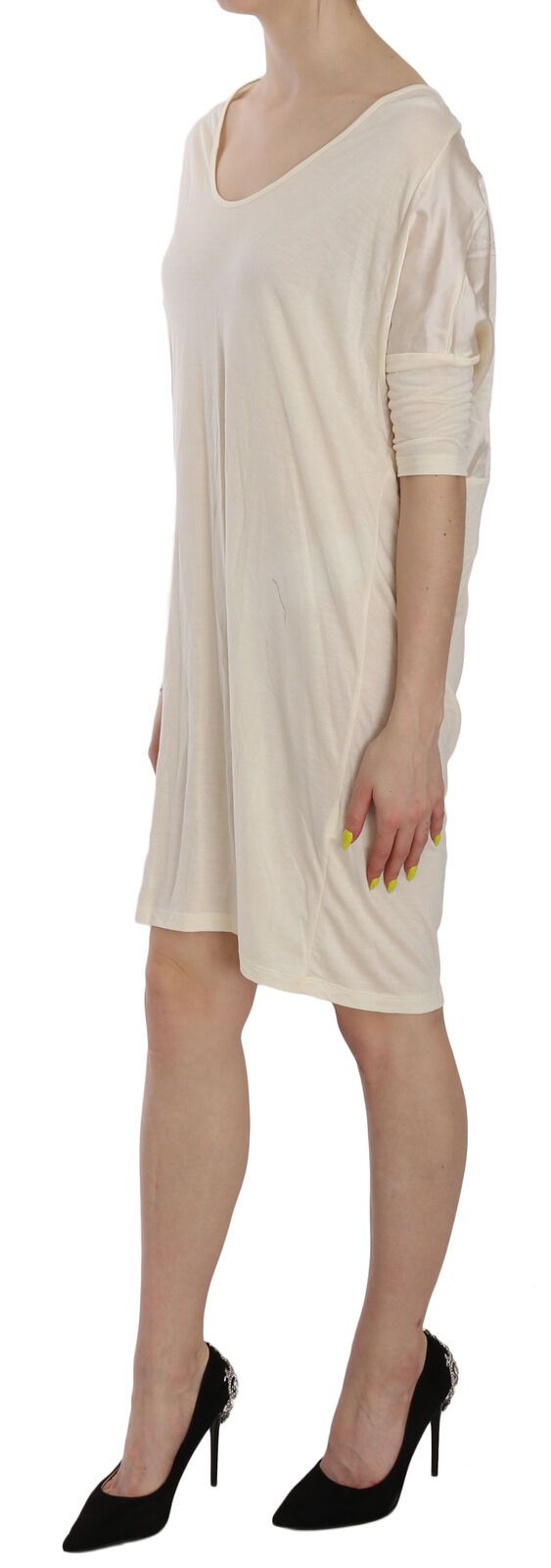 A knee length dress with a round neckline, worn by a model