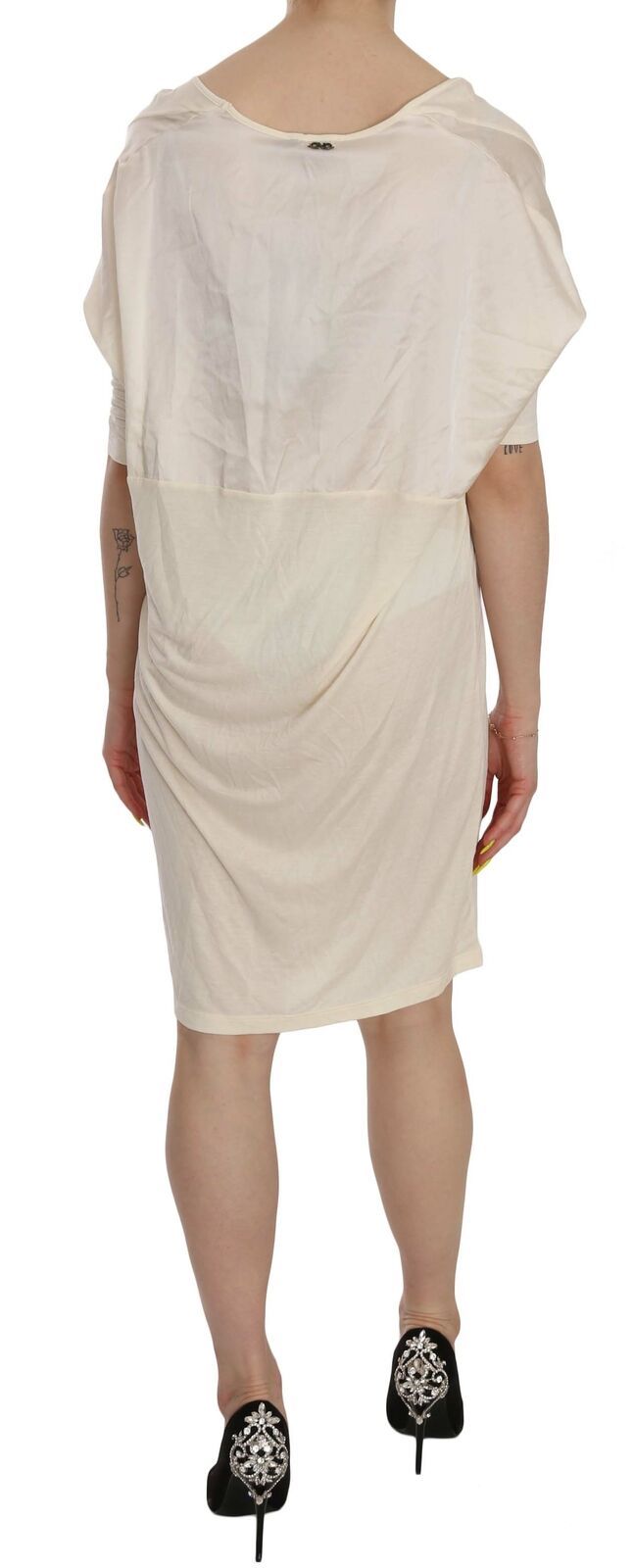 A knee length dress with a round neckline, worn by a mannequin
