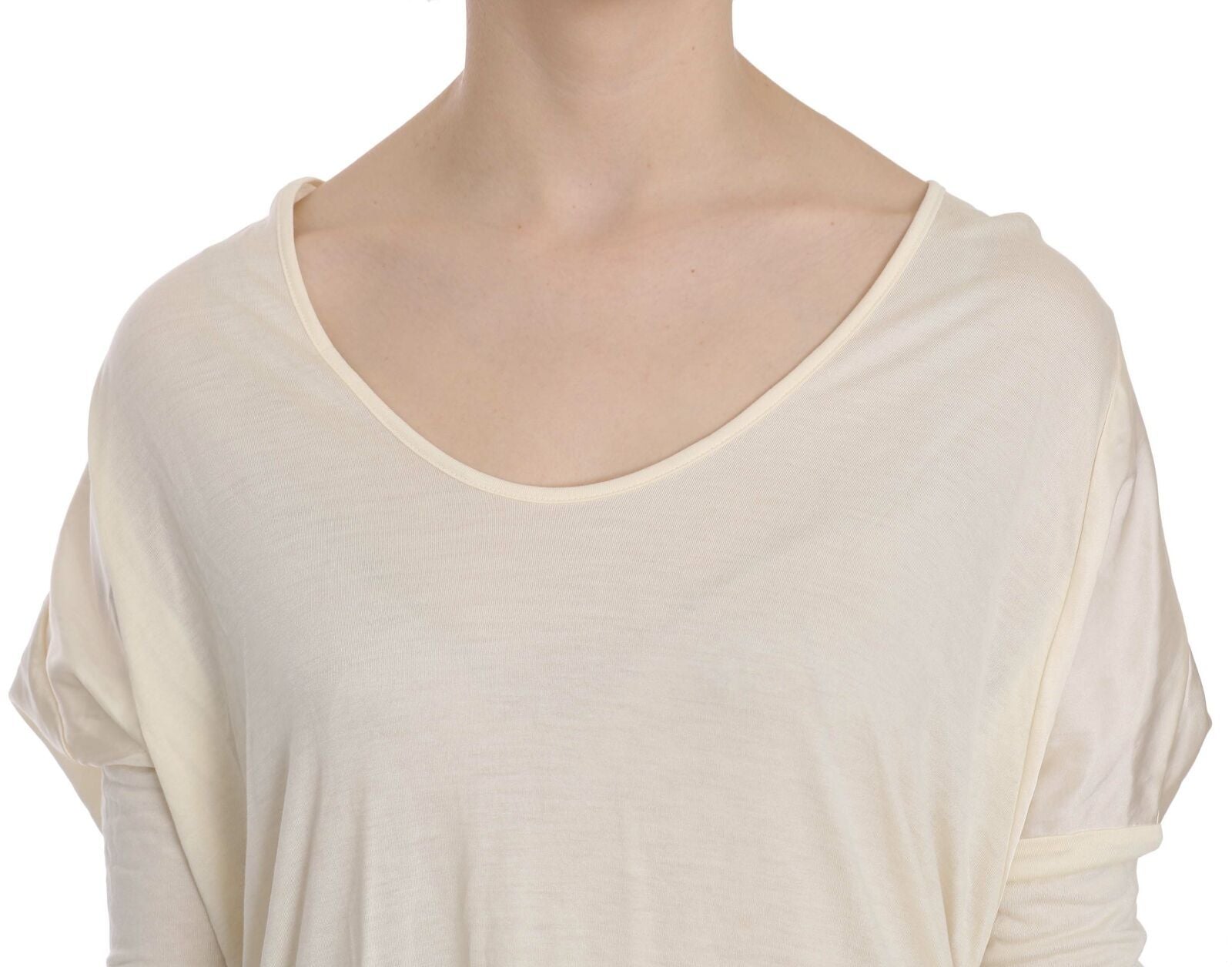 A cream round neck knee length dress from Costume National