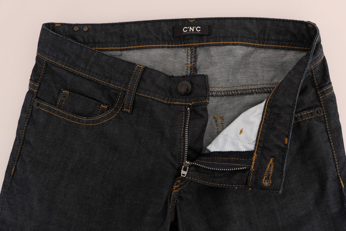 Pair of blue denim jeans with visible stitching and pockets