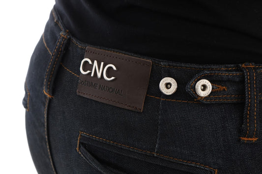 Pair of blue jeans with a brown belt loop and a label on the back pocket
