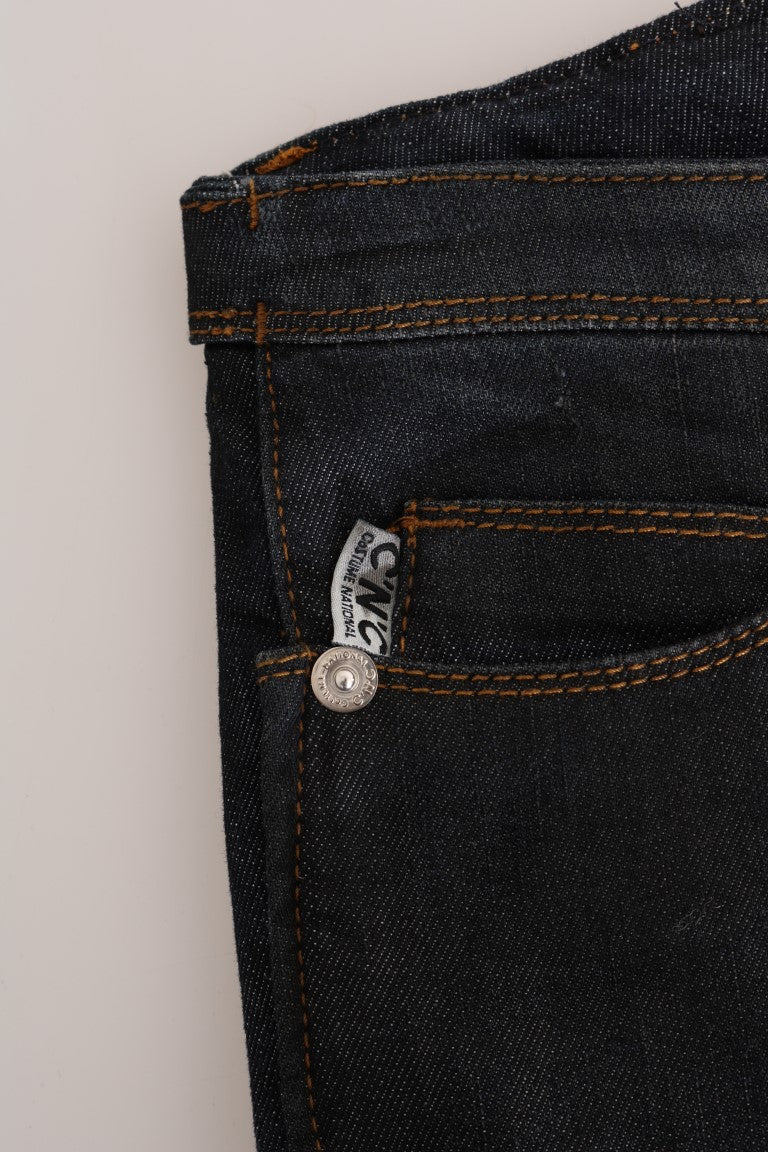 Pair of blue jeans with a silver button on the waistband