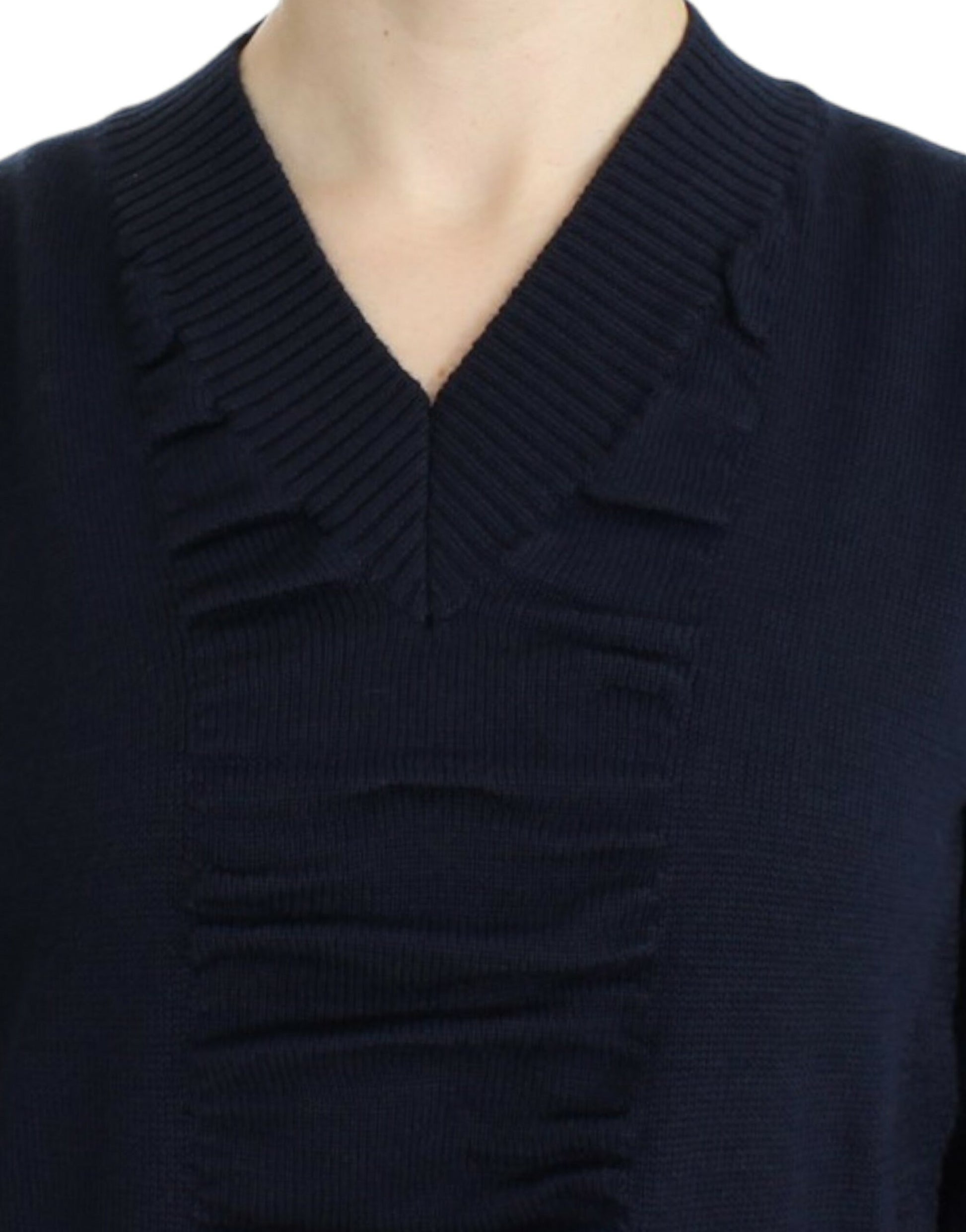 Blue knit sweater with ruffled neckline