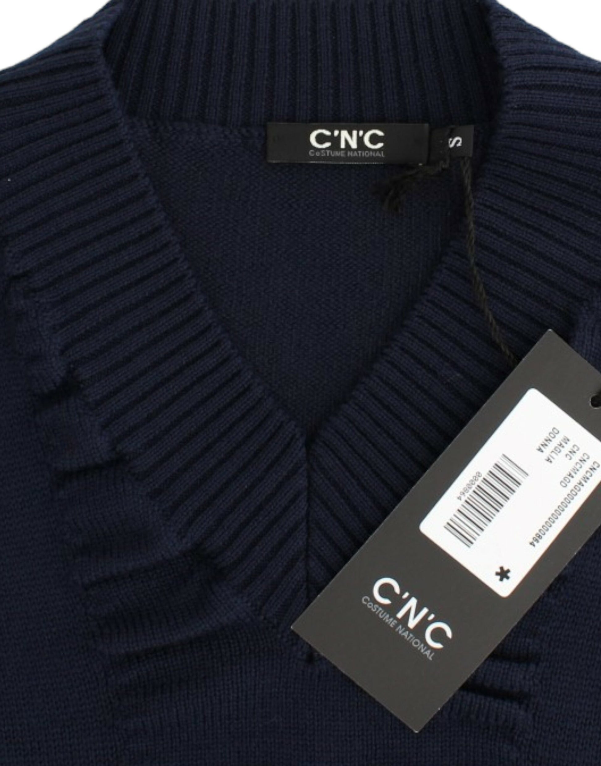 Blue sweater on hanger with tag