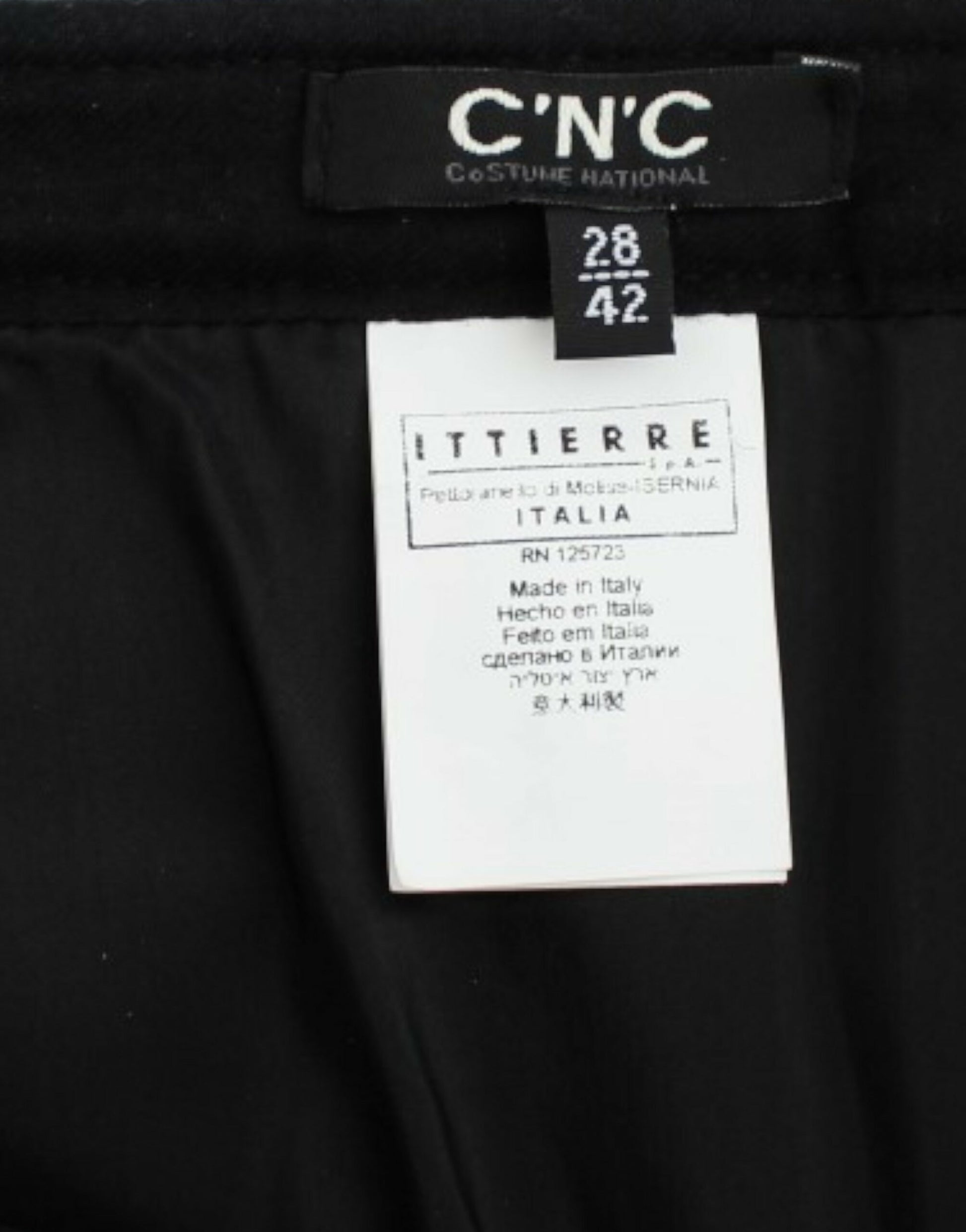 Black pants tagged with CNC and Itierre