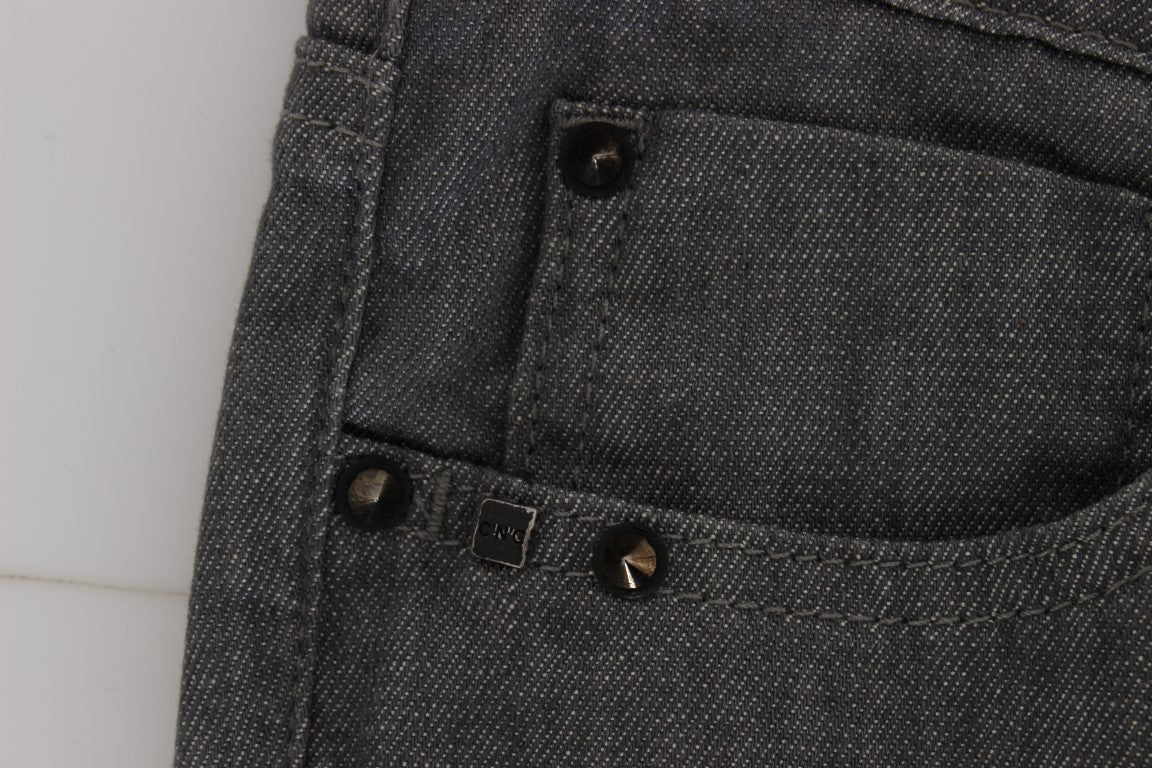 Pair of blue jeans with button closure