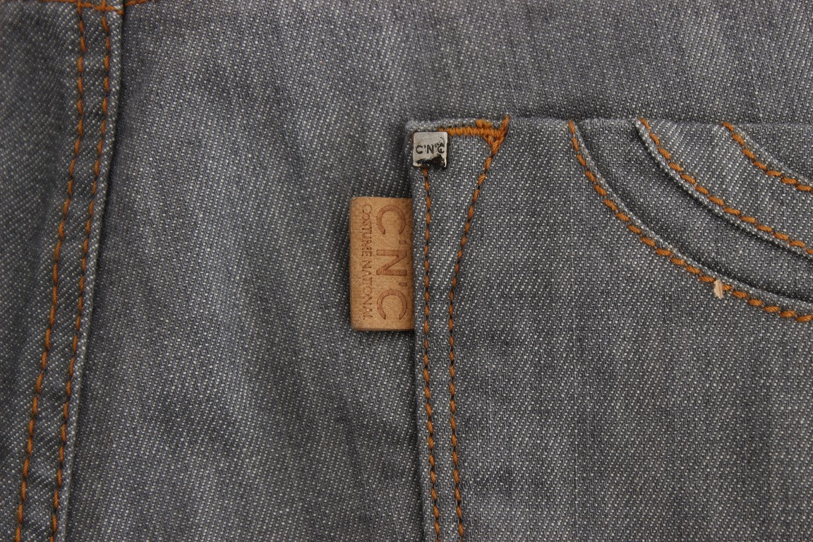 Blue denim jeans with orange stitching on pocket