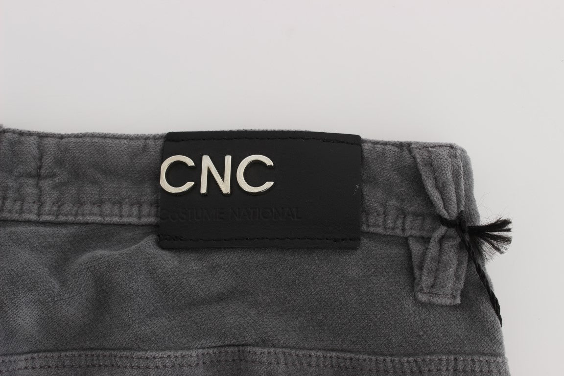 A pair of jeans with a tag on the waistband that reads "C&A CNC"