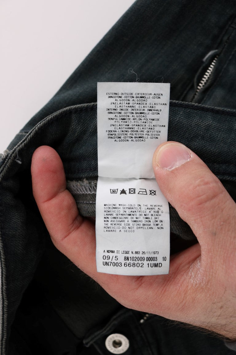 Hand holding a tag on jeans
