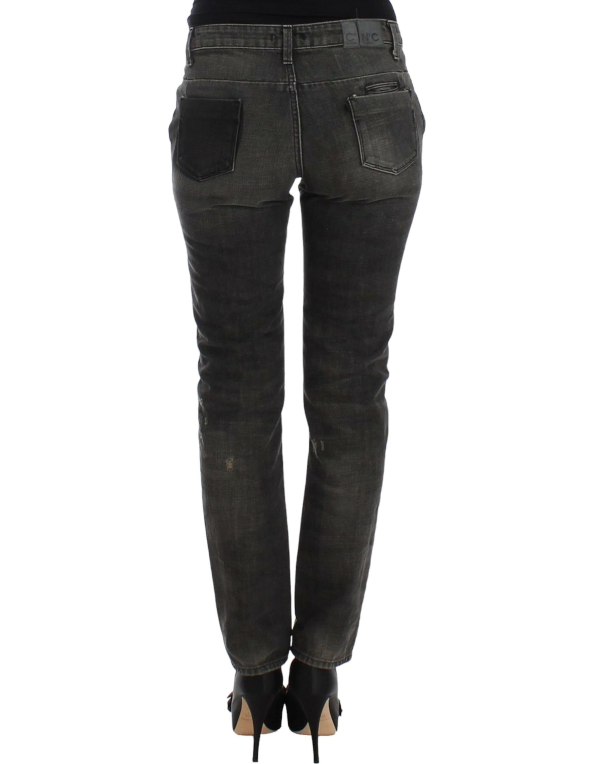 Pair of dark wash jeans with distressed details and pockets