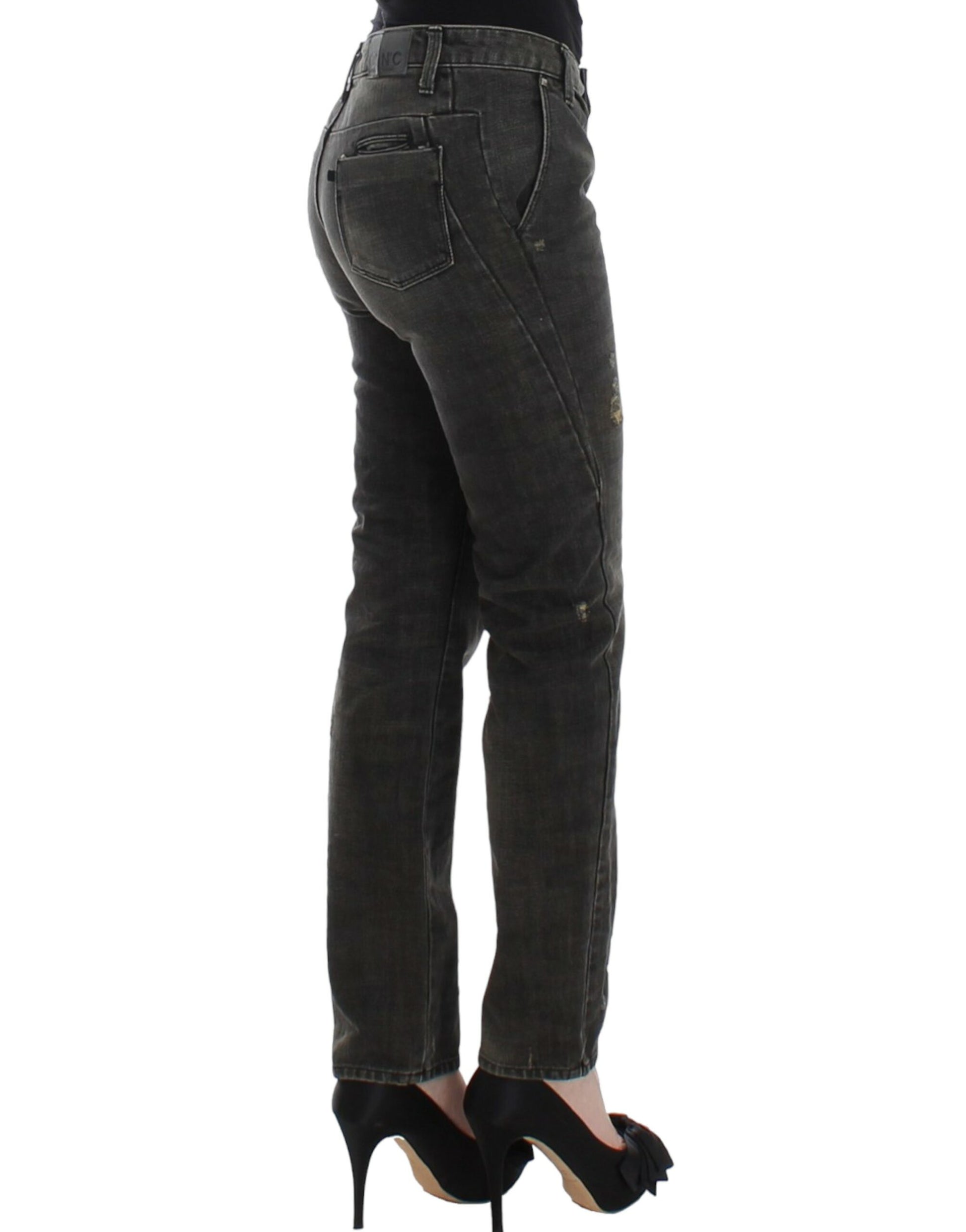 Woman wearing blue jeans and black heels