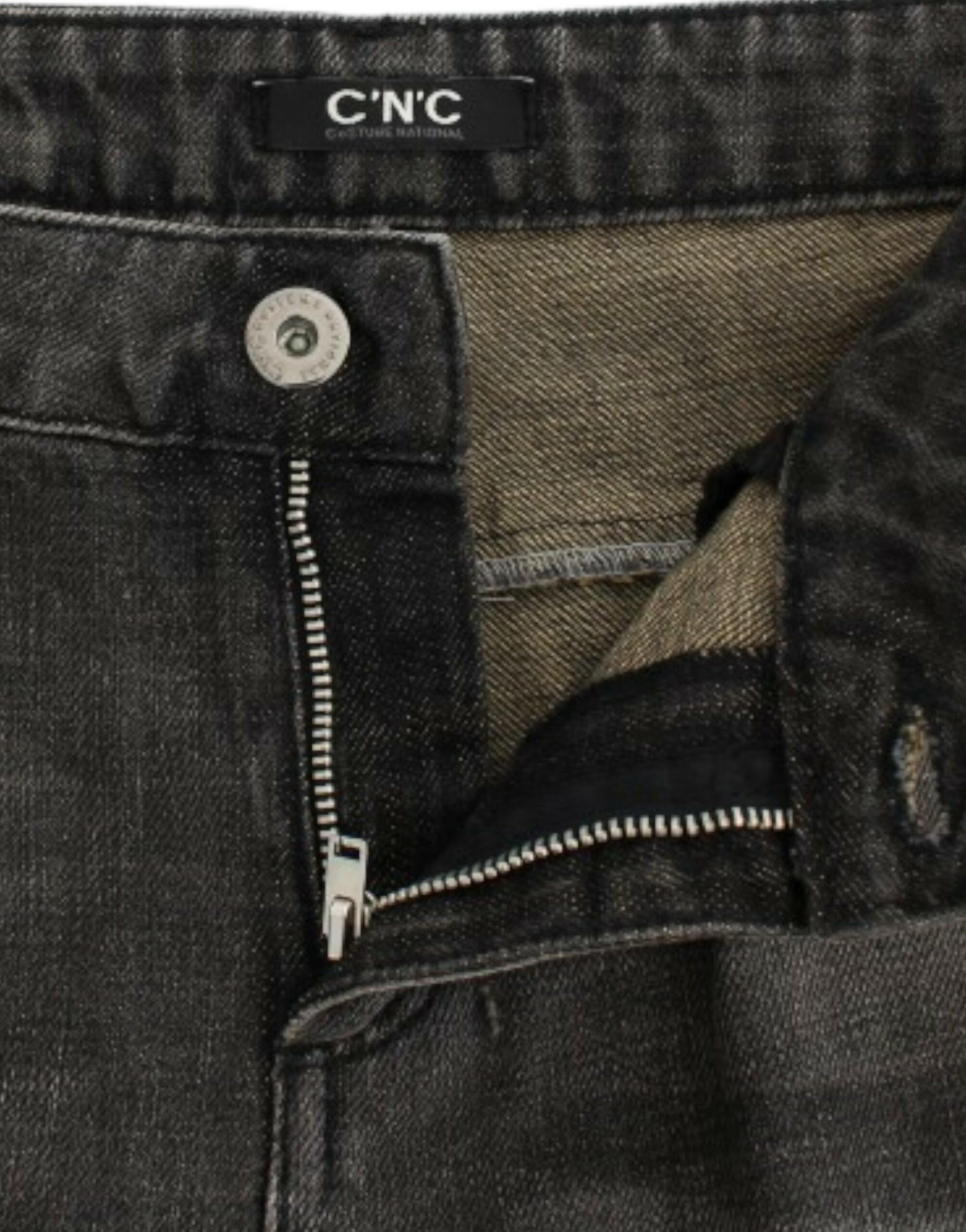 Pair of blue jeans with zipper and button closure