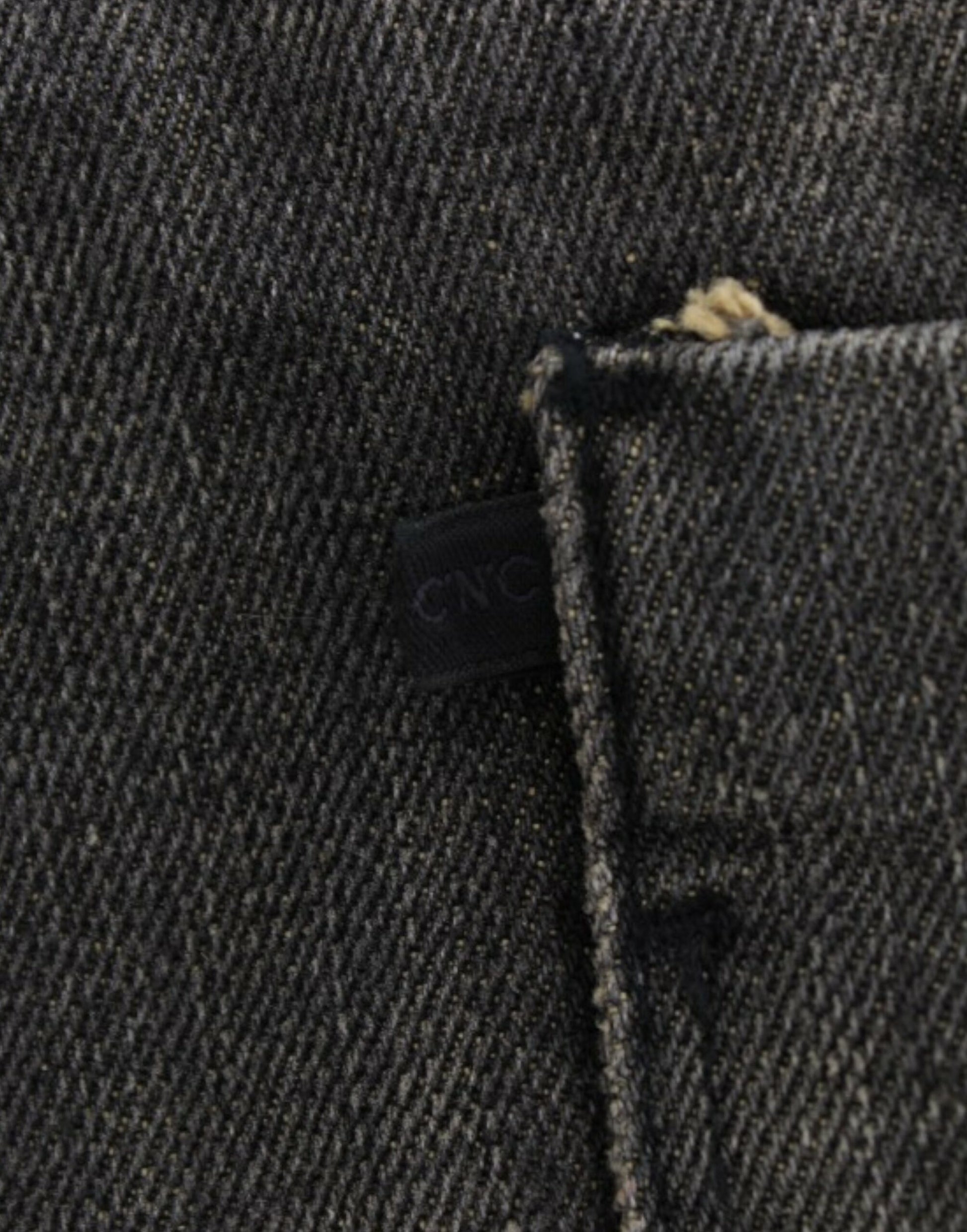 Denim jeans with button closure and visible stitching