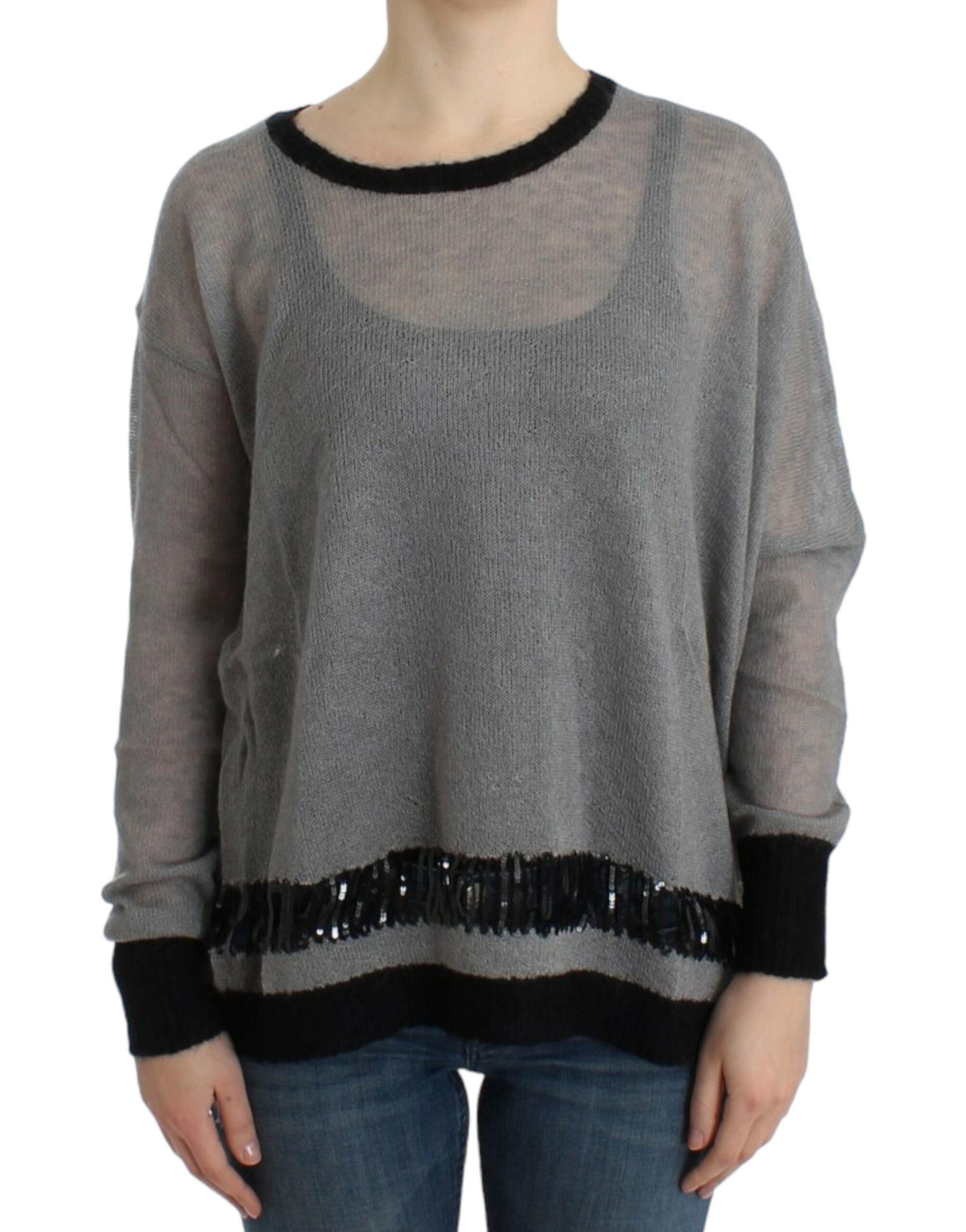 Long sleeve knit sweater with fringe detailing on neckline