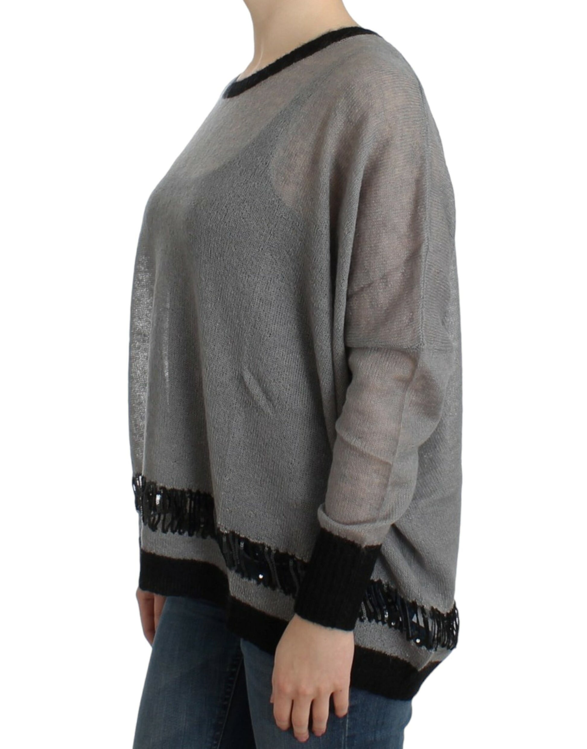 Long sleeve knit sweater with fringe detailing on cuffs