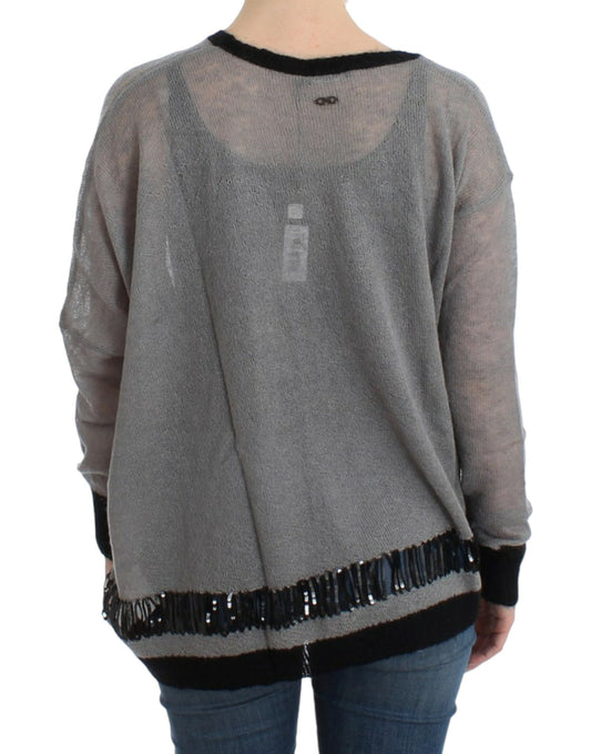 Long sleeve knitted sweater with fringe detailing on back