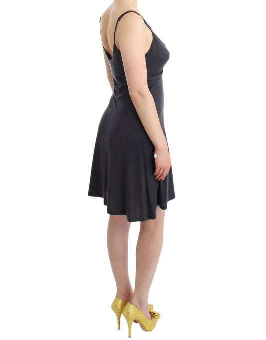 Woman wearing black dress and yellow heels