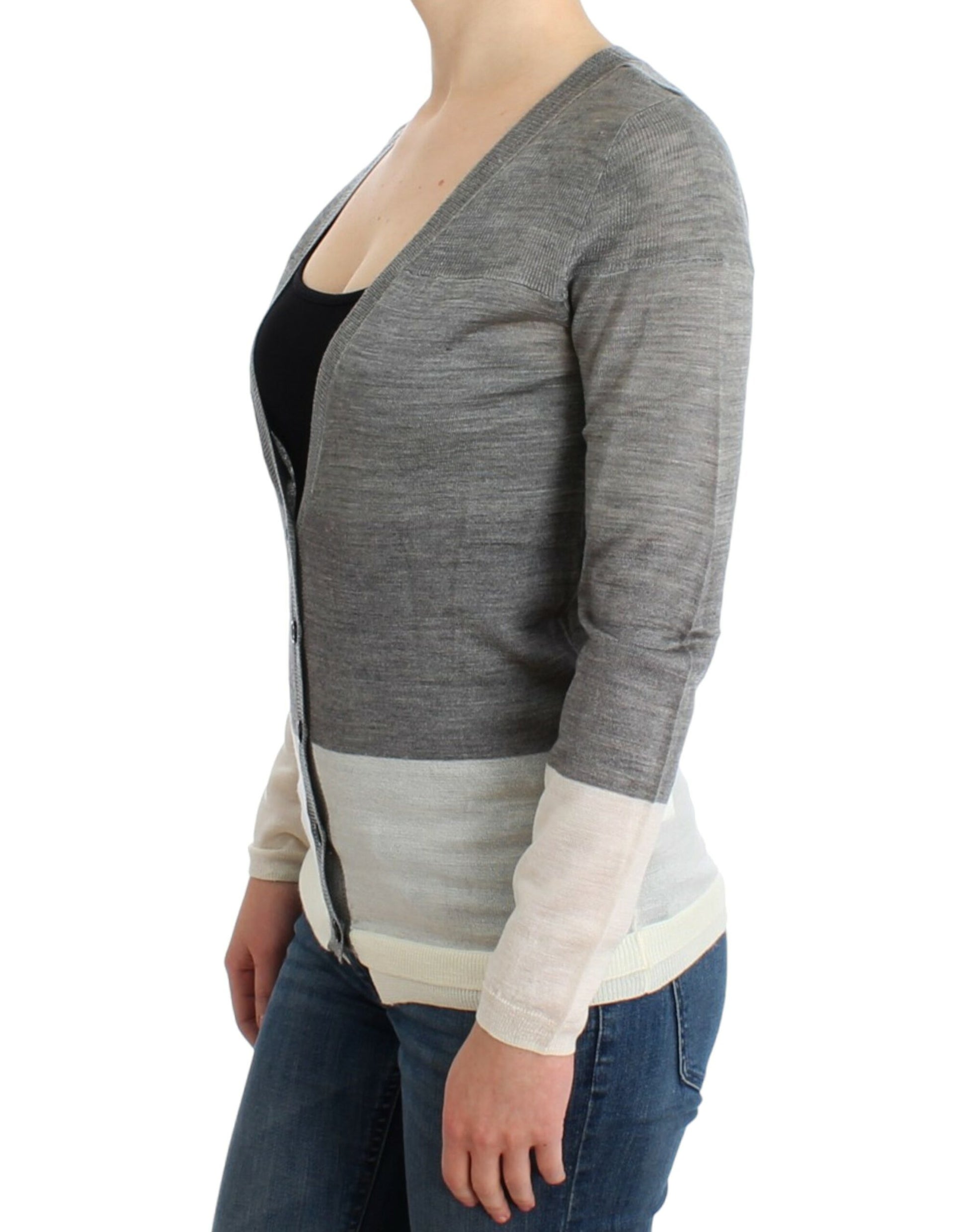Woman wearing a gray cardigan over black top