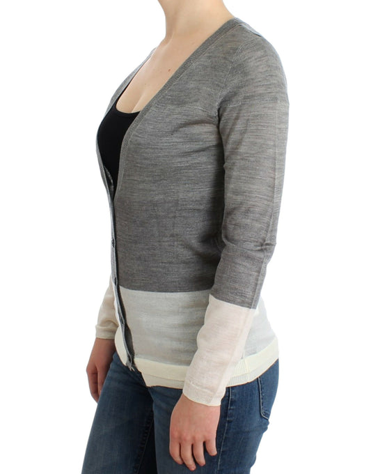 Woman wearing a gray cardigan over black top