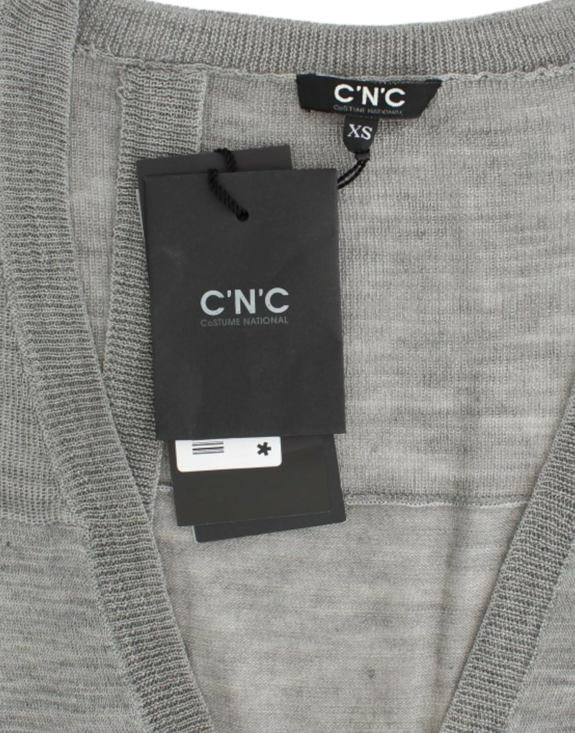 Grey sweater on hanger with tag