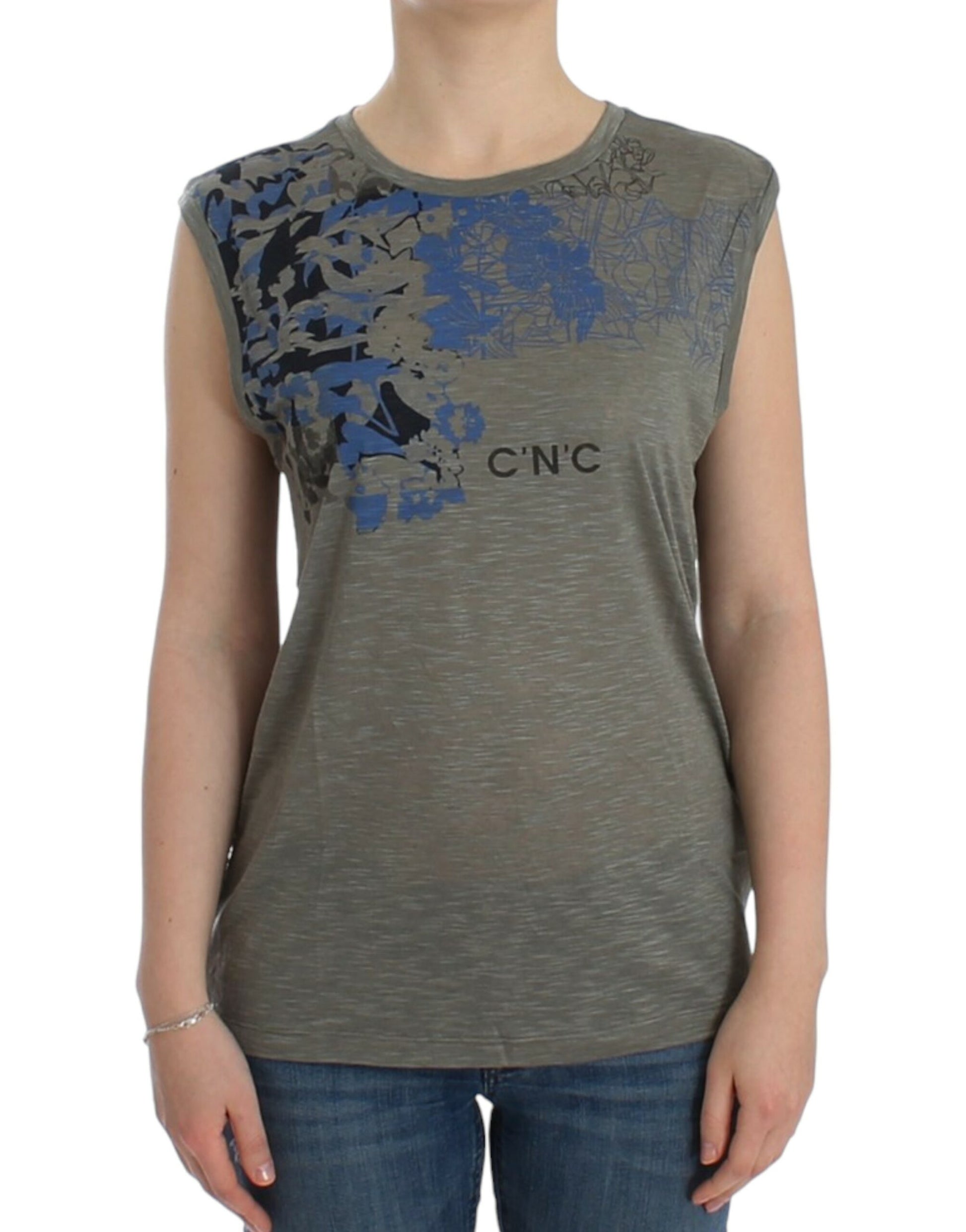 Woman wearing gray tank top with blue design on front
