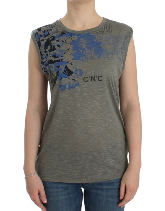 Woman wearing gray tank top with blue design on front