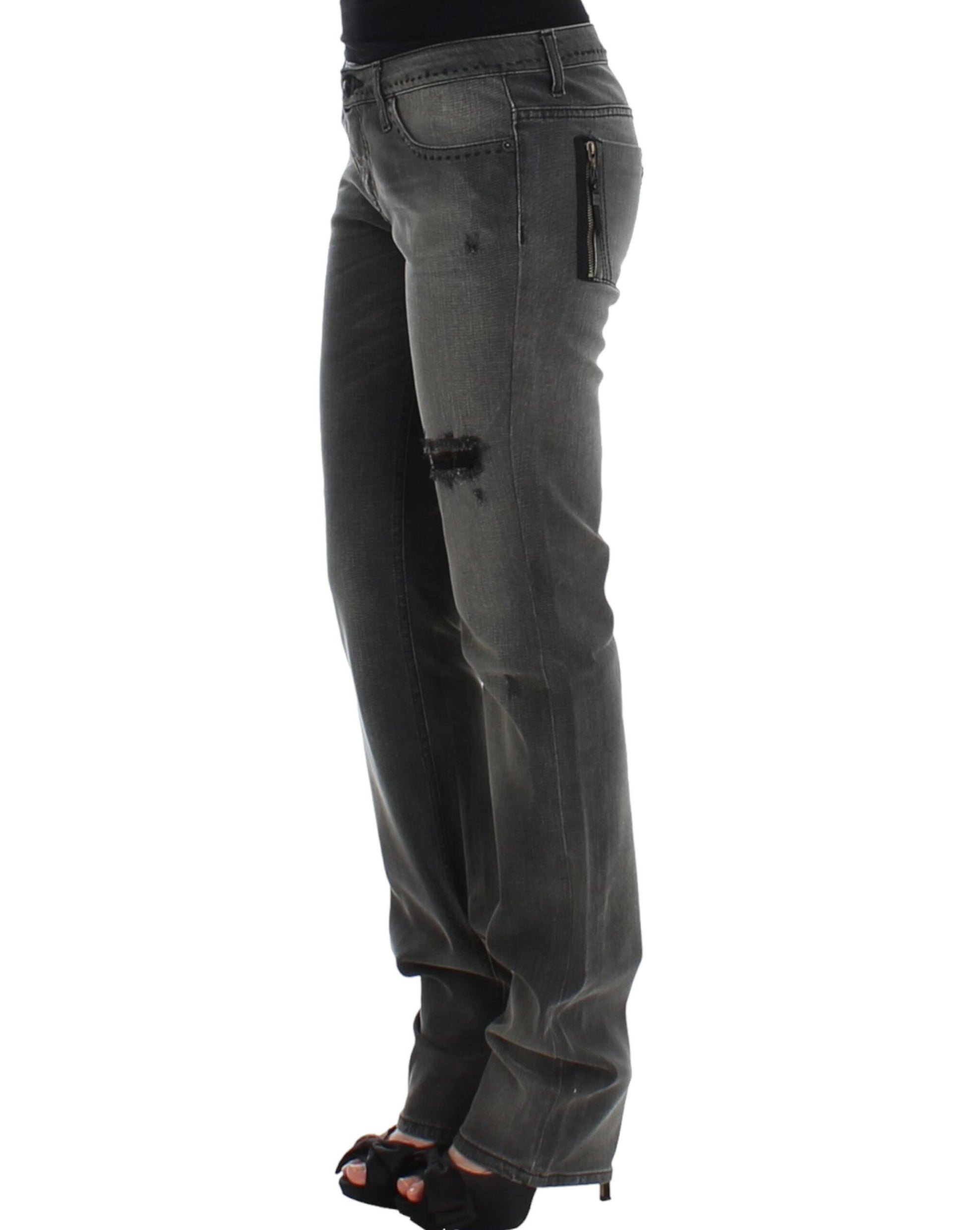 Woman wearing jeans with distressed areas and high heels