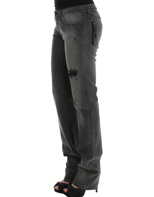 Woman wearing jeans with distressed areas and high heels